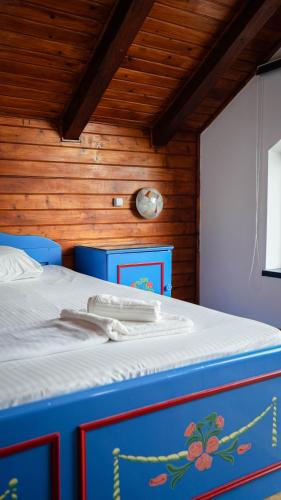 a blue and red bed in a room at Casa Bendis in Eforie Nord