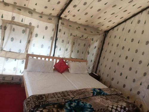 a bedroom with a bed in a tent at Town Front Camping in Leh