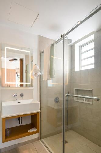 a bathroom with a sink and a shower at Ocean Point B3 in Pointe aux Piments