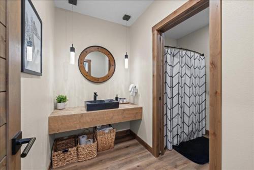 a bathroom with a sink and a mirror at Hauser House Unit 1 Dog Friendly in Red Lodge