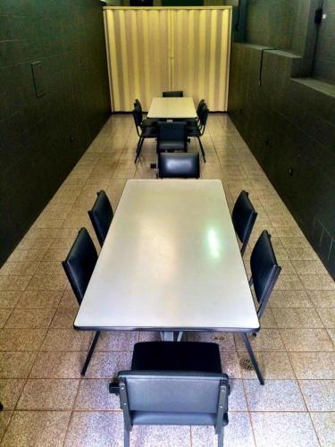 a group of tables and chairs in a room at Princetel Palace Hotel in Londrina