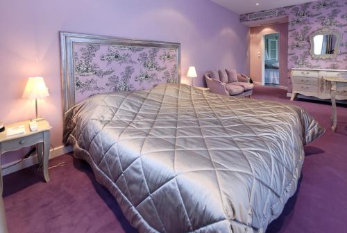 Un ou plusieurs lits dans un hébergement de l'établissement Domaine d'Auriac - Relais & Châteaux
