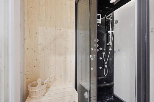 a room with wood paneling and a glass wall at Serenity on 13 Suncadia-luxury 4bd ensuite spa retreat with Sauna, Steam Shower, Jacuzzi, Hot tub, Fire Pit & on-site EV chg in Cle Elum