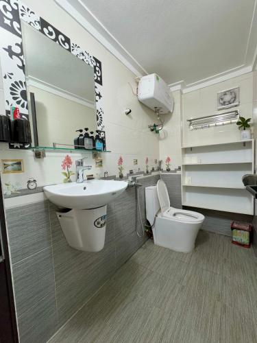 a bathroom with a sink and a toilet at Hava House Lang Son in Lạng Sơn