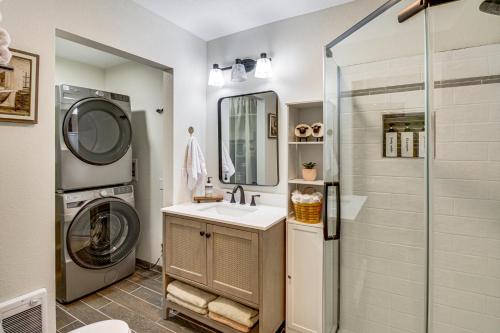 a bathroom with a sink and a washing machine at Long Lake Cabin w/ Dock: Fish & Hike! in Walker