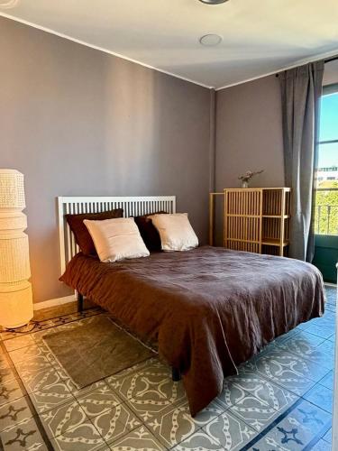 a bedroom with a large bed in a room at Rambla Riverview in Girona
