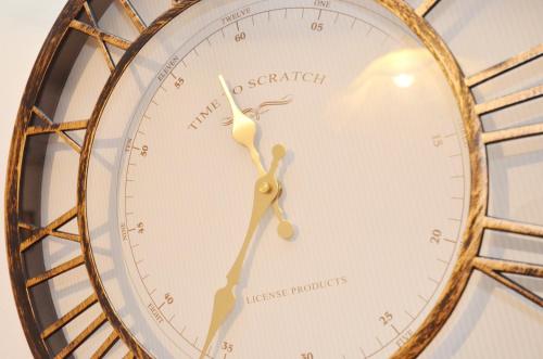 a close up of a clock on a wall at Cozy Central Nest Kotor in Kotor