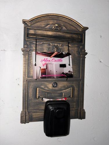 an old wood stove is hanging on a wall at Historic Alex Castle Apartment Lake Como in Gravedona