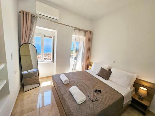 a bedroom with a bed with glasses on it at Casa Nevina in Marathokampos