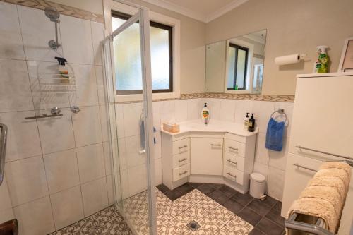 a bathroom with a shower and a sink at Flinders Ranges Bed and Breakfast in Hawker