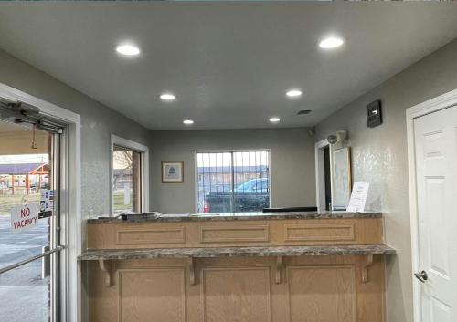 a room with a large counter with a window at Regency Inn Hondo in Hondo