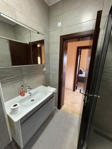 a bathroom with a sink and a mirror at Villa in Čeluga