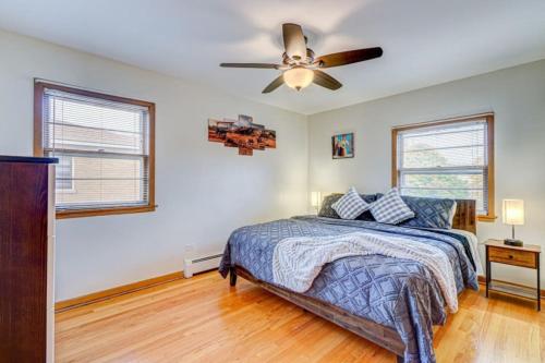 a bedroom with a bed and a ceiling fan at King Bed • 2BR • Sleeps 13 • Historic Location in Elmwood Park