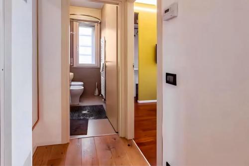 a bathroom with a toilet and a window at Rifugio a due passi dal mare in Rimini