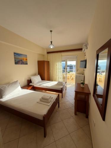 Säng eller sängar i ett rum på Nevi Rooms
