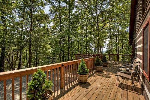 a deck with chairs and trees on a house at Mountain Retreat in Morganton
