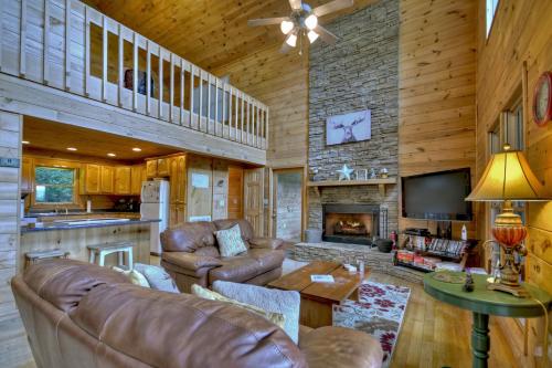 a living room with leather furniture and a fireplace at My Mountain Paradise in Morganton