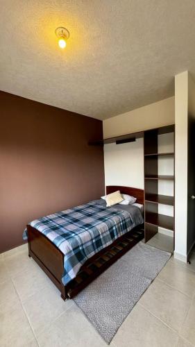 a bedroom with a bed in a room with a ceiling at Casa completa y equipada in Saucillo de la Joya