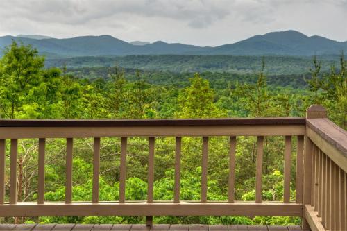 a wooden deck with a view of the mountains at RendezView in Morganton