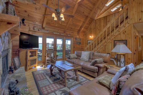 a living room with a couch and a table at Storybook in Morganton