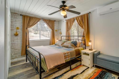 a bedroom with a bed and a ceiling fan at Payson Summer Getaway w/ Backyard in Payson
