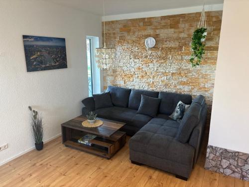 a living room with a couch and a coffee table at KC Appartments in Schwanau