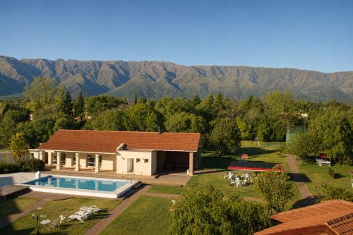an aerial view of a house with a swimming pool at Villa de Merlo All Inclusive & Spa by MH in Merlo
