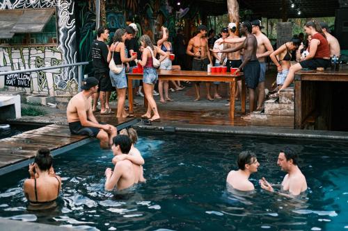 a group of people in a swimming pool at Raindance Hostel in Santa Cruz