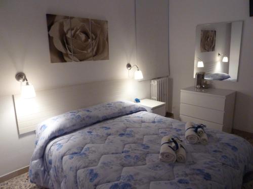a bedroom with a bed with shoes on it at B&Belvedere, affittacamere in San Benedetto del Tronto
