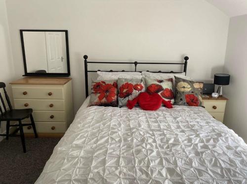 a bedroom with a bed with teddy bears on it at Rhos cottage Ruthin in Ruthin