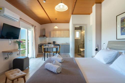 a bedroom with a large bed with two pillows on it at Siora Maria in Argostoli