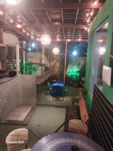 a view of a patio with a table and chairs at Pousada Porto Marola in Porto De Galinhas
