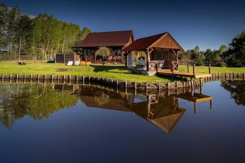 Holiday home with private pond, jacuzzi and sauna
