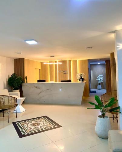 a lobby with a reception desk in a building at Delfin Hotel Collection Rodadero in Rodadero