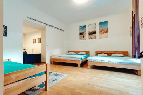 a room with two beds in a room at City Center Studio in Graz