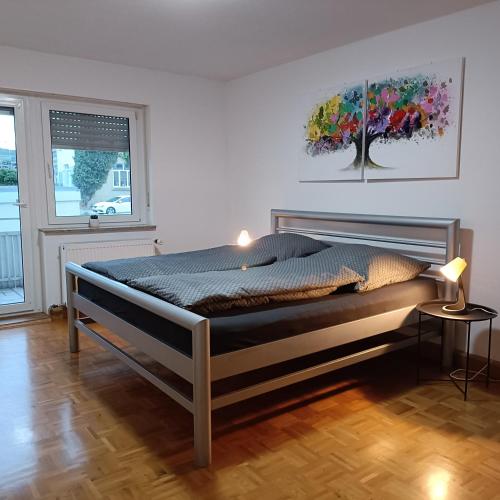 a bedroom with a large bed in a room at City-Quartier in Bad Mergentheim