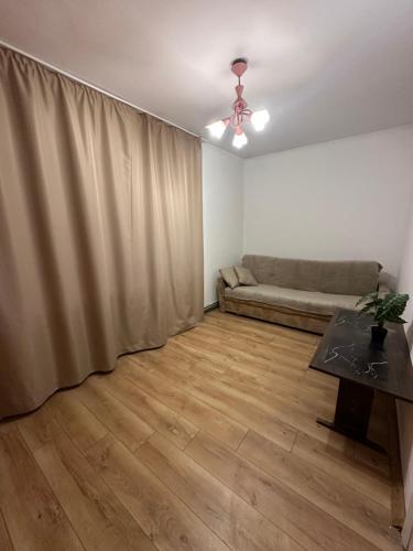a living room with a couch and a table at Horodotska Street in Lviv