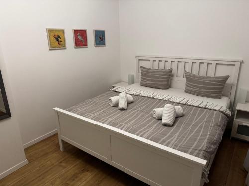 a bed with two pillows on it in a bedroom at Chalet Relax in Birresborn