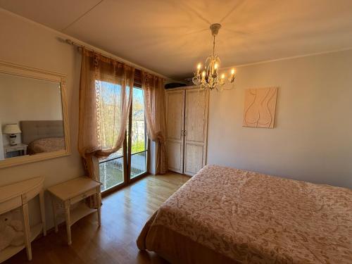 a bedroom with a bed and a table and a window at Masti Apartment in Tallinn