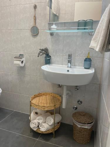 a bathroom with a sink and a toilet and towels at Villa Mira in Bol