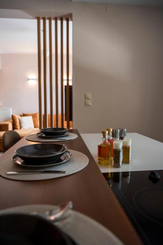 a table with plates of food on top of it at Jo's Apartment in Mytilene