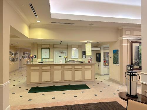 a large kitchen with a large island in a room at Arnot Grand Hotel & Suites in Horseheads