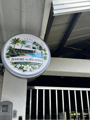 a sign hanging from the ceiling of a building at Jasmin Czechinn in Dauis