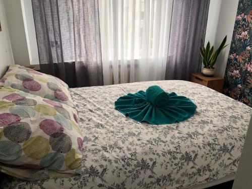 a bedroom with a bed with a pillow on it at Z widokiem na Jaworzynę in Krynica Zdrój
