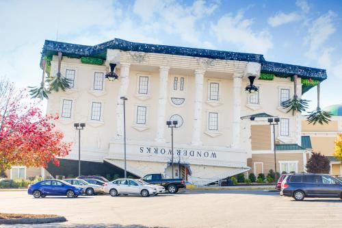 a large building with cars parked in a parking lot at Microtel Inn & Suites by Wyndham Pigeon Forge in Pigeon Forge