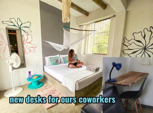 a girl sitting on a bed in a room at Freesoul Hostel in Palomino