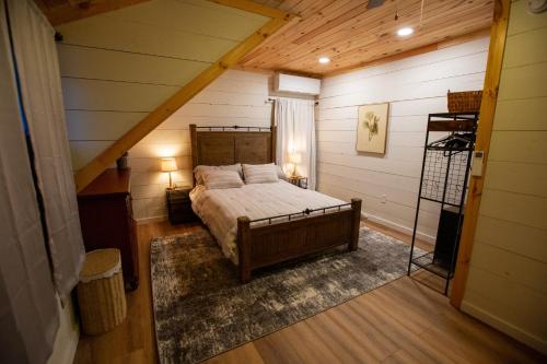 a bedroom with a bed in a attic at Beautiful Bridgton Apartment in Bridgton