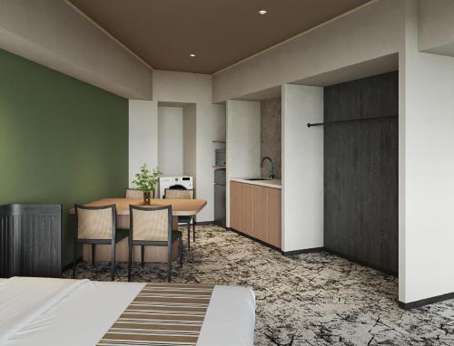 a kitchen and dining room with a table and chairs at Premium hotel MONday MAIHAMA VIEW 2 in Tokyo