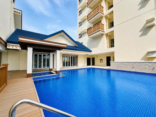 a swimming pool in the middle of a building at Boho-Nordic Studio at Twin Lakes Vineyard, Tagaytay by Cozy Escape in Laurel