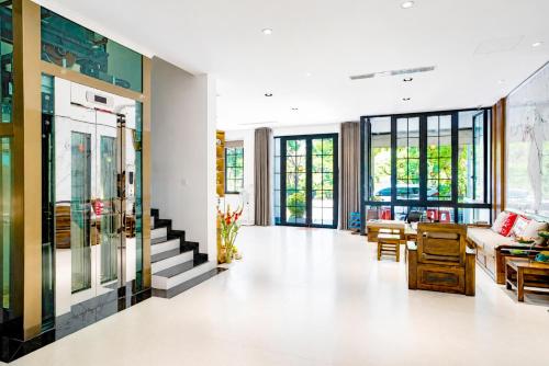 a living room with a couch and a table at COBI’s Home in Cam Lâm